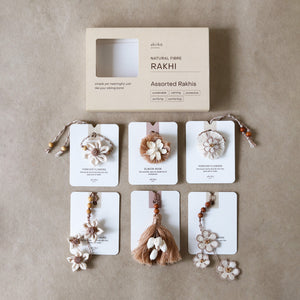 Jasmine Twirl Rakhi Trio (2 rakhis, 1 lumba)