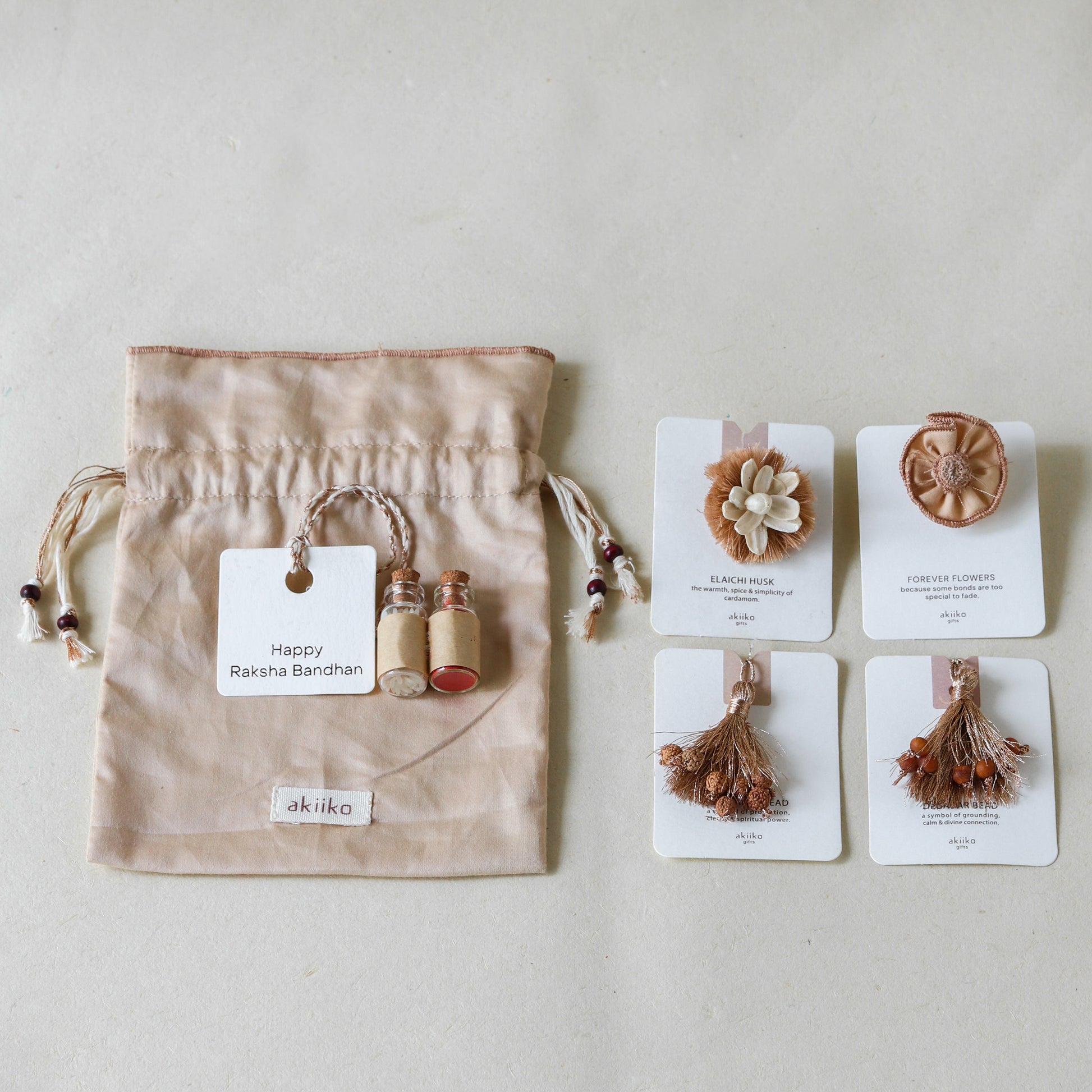 Warm Celebrations: Rakhi Set (2 Rakhis, 2 Lumbas)