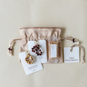 Sacred Sandalwood: Rakhi Set ( 2 Rakhis - 1 Sweet )