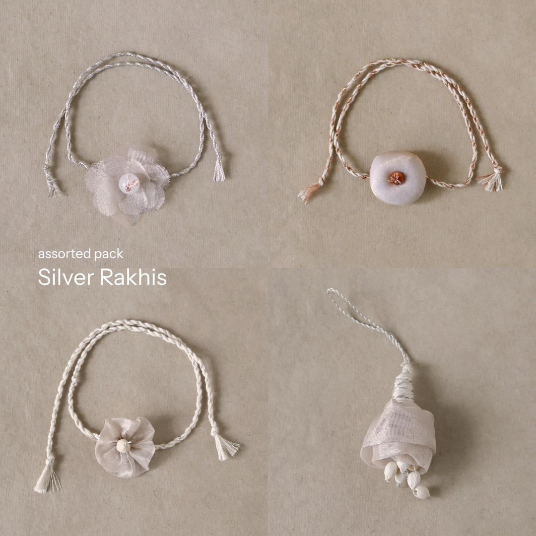 Silver Glow Potli Set (3 Rakhis, 1 Lumba)