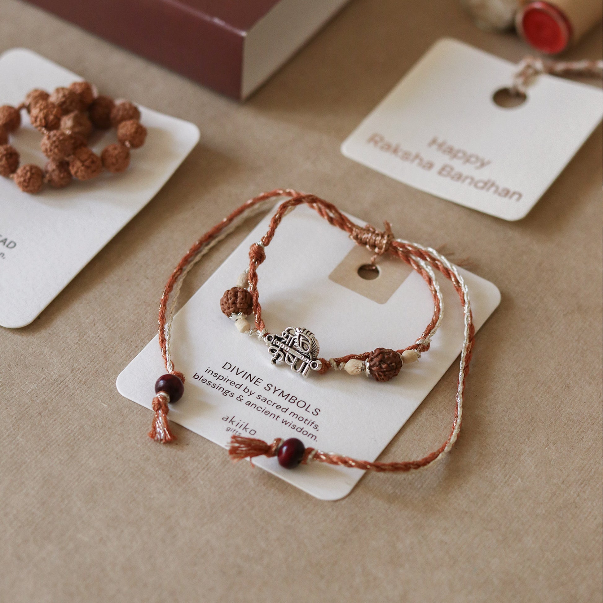 Divine Charm Rakhi Trio (3 Rakhis)