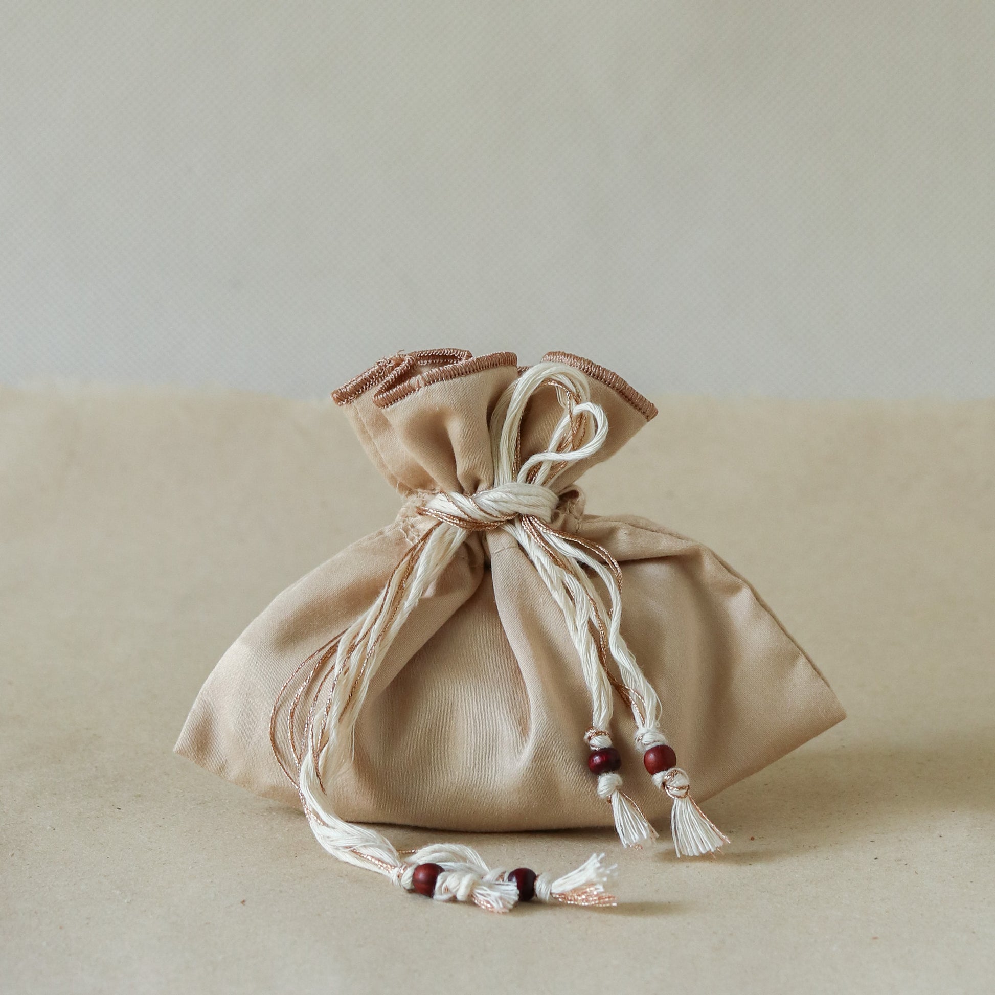 Sacred Sandalwood: Rakhi Set ( 2 Rakhis - 1 Sweet )