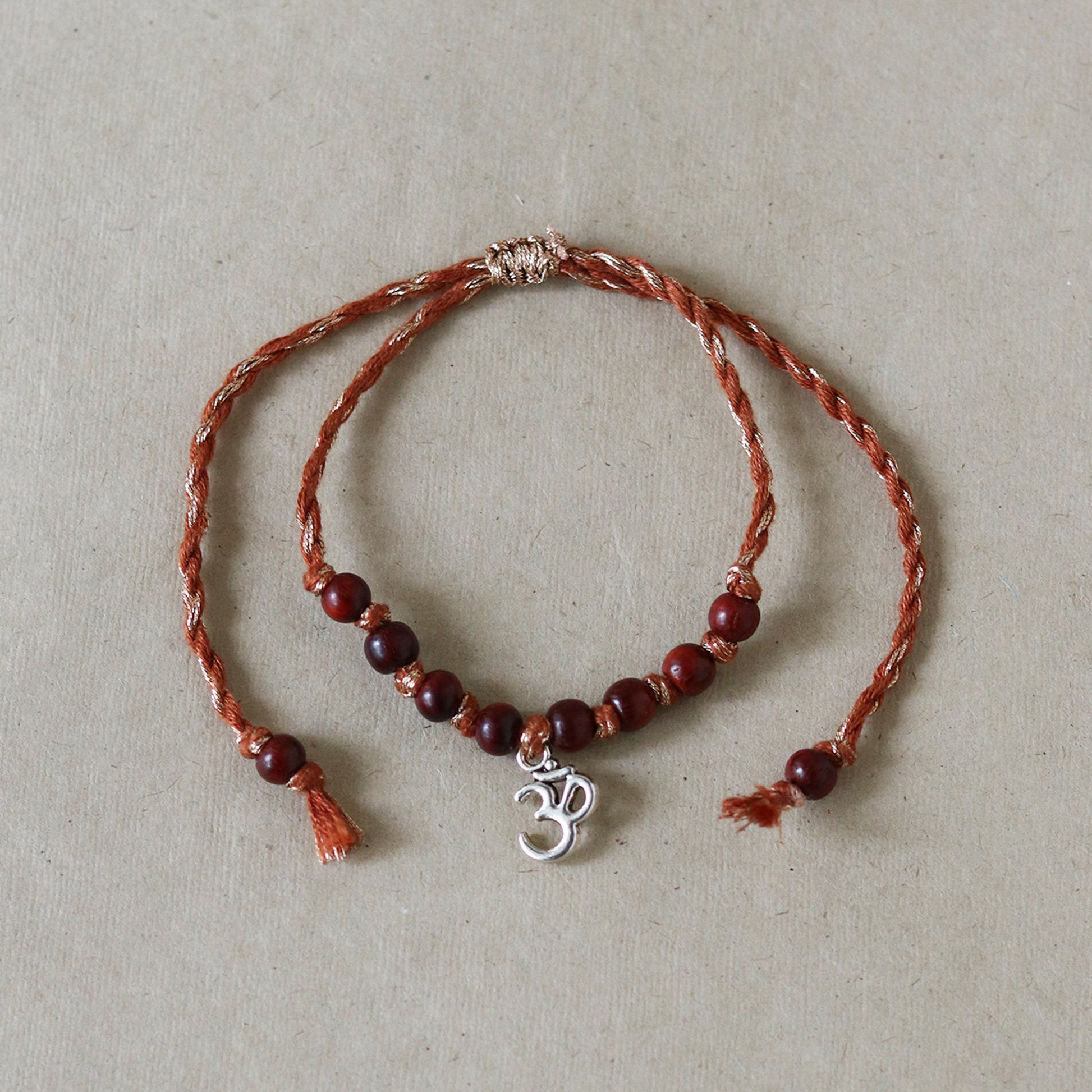 Om Charm Red Sandalwood Rakhi