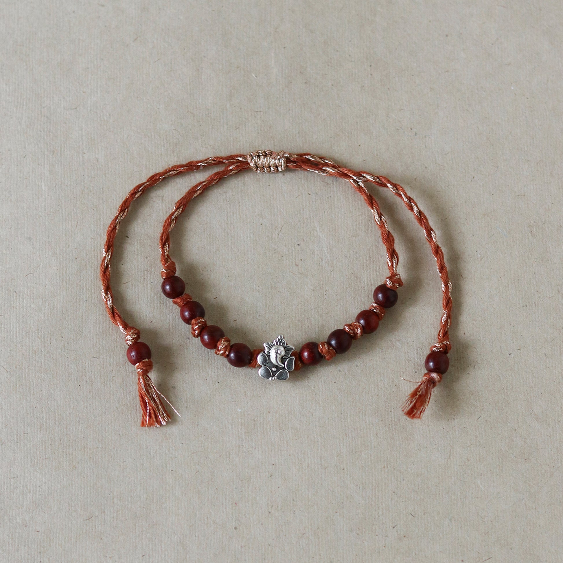 Ganesha Charm Red Sandalwood Rakhi