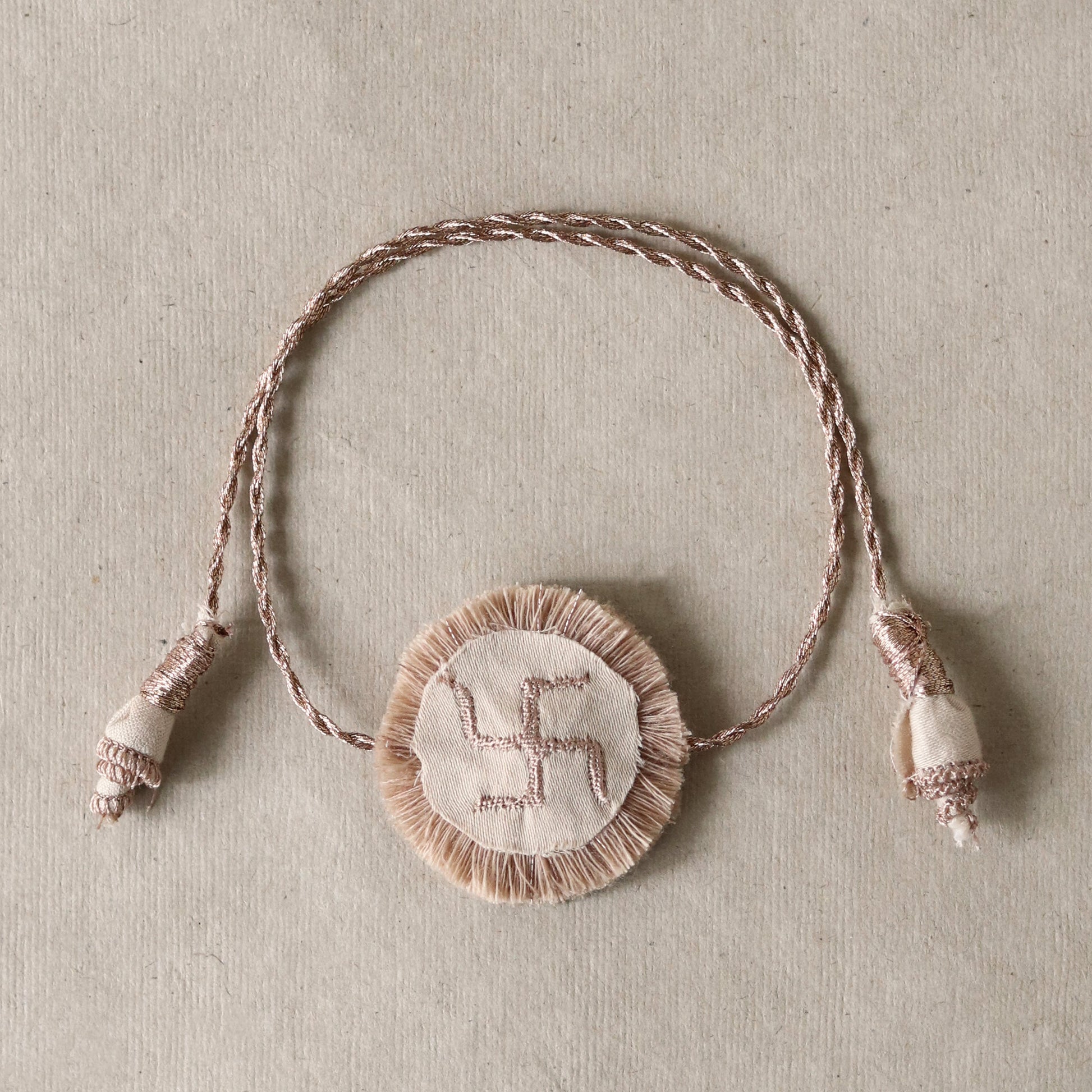 Golden Swastik Disc Rakhi