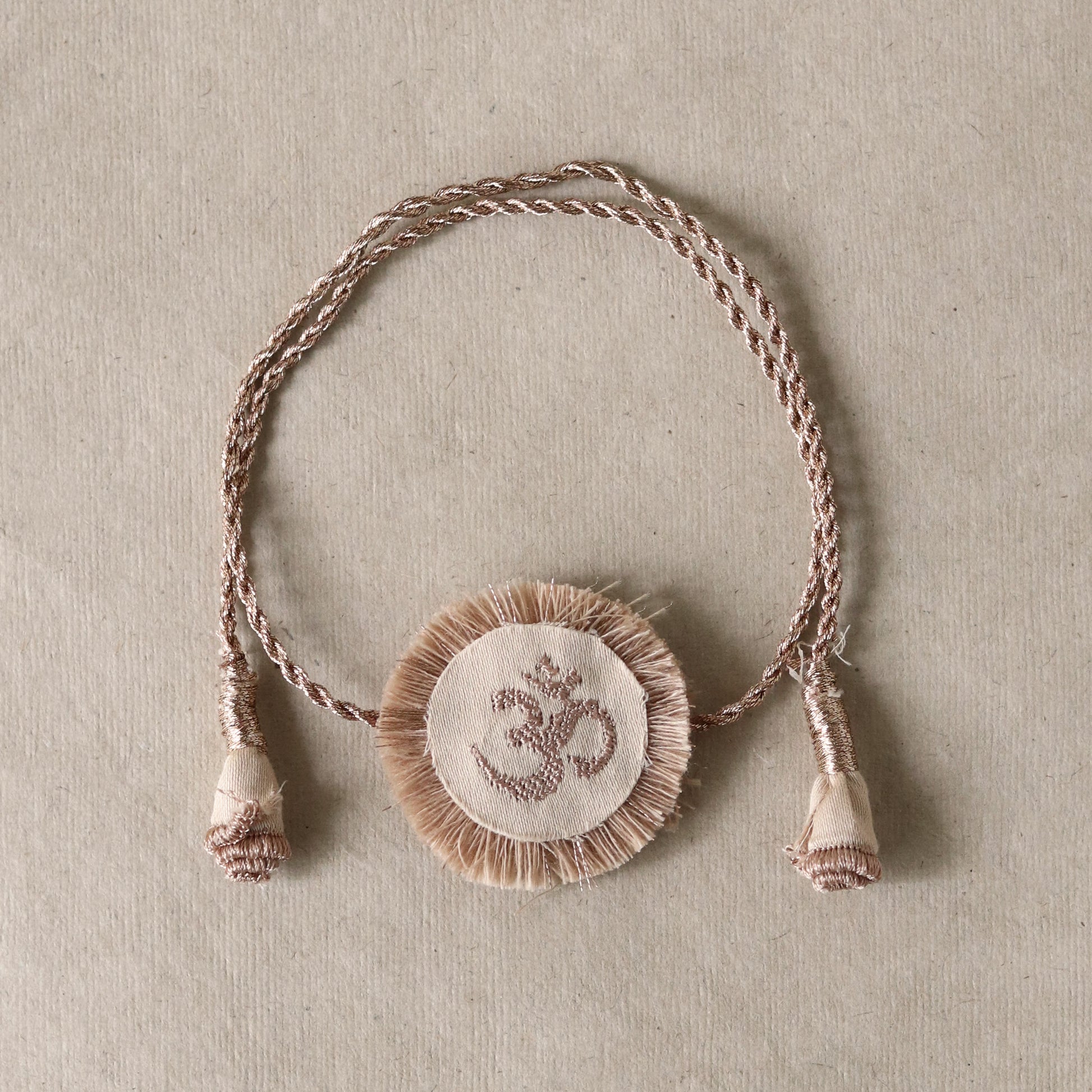 Golden Om Disc Rakhi