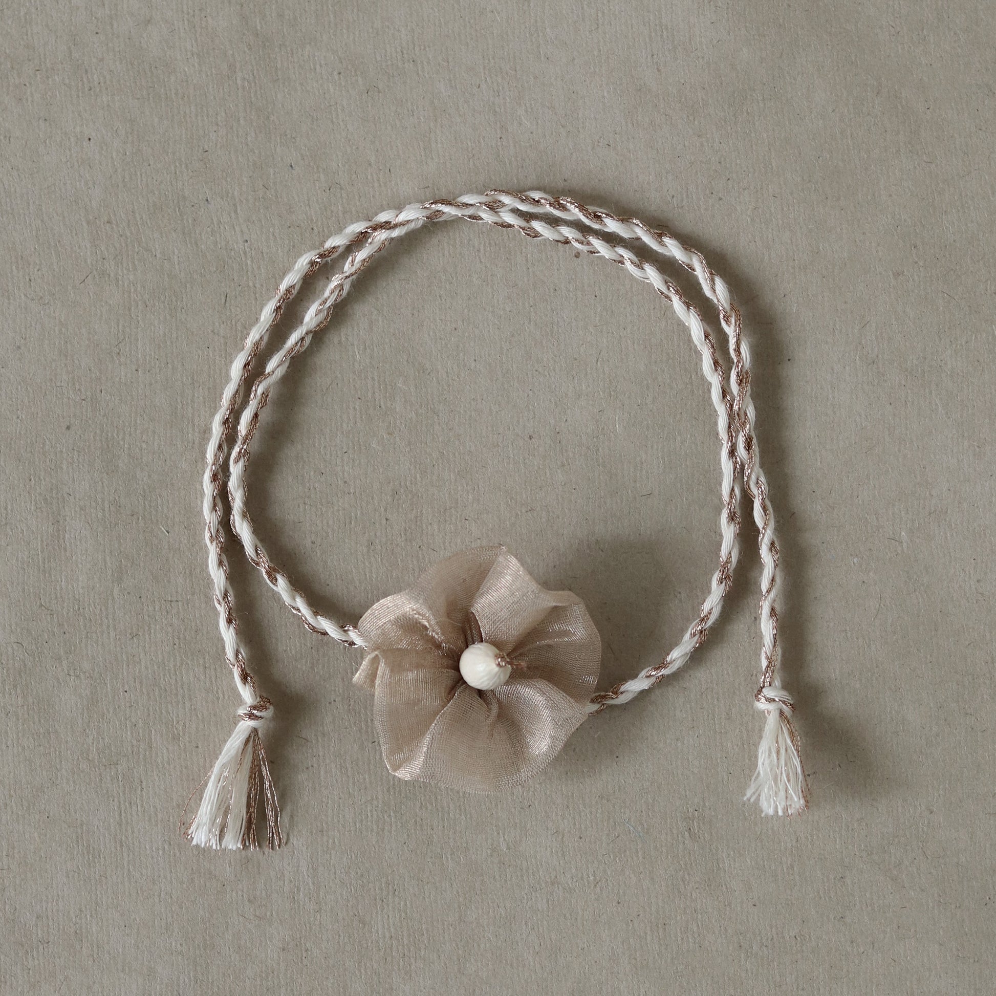 Gardenia Glow Rakhi-Gold