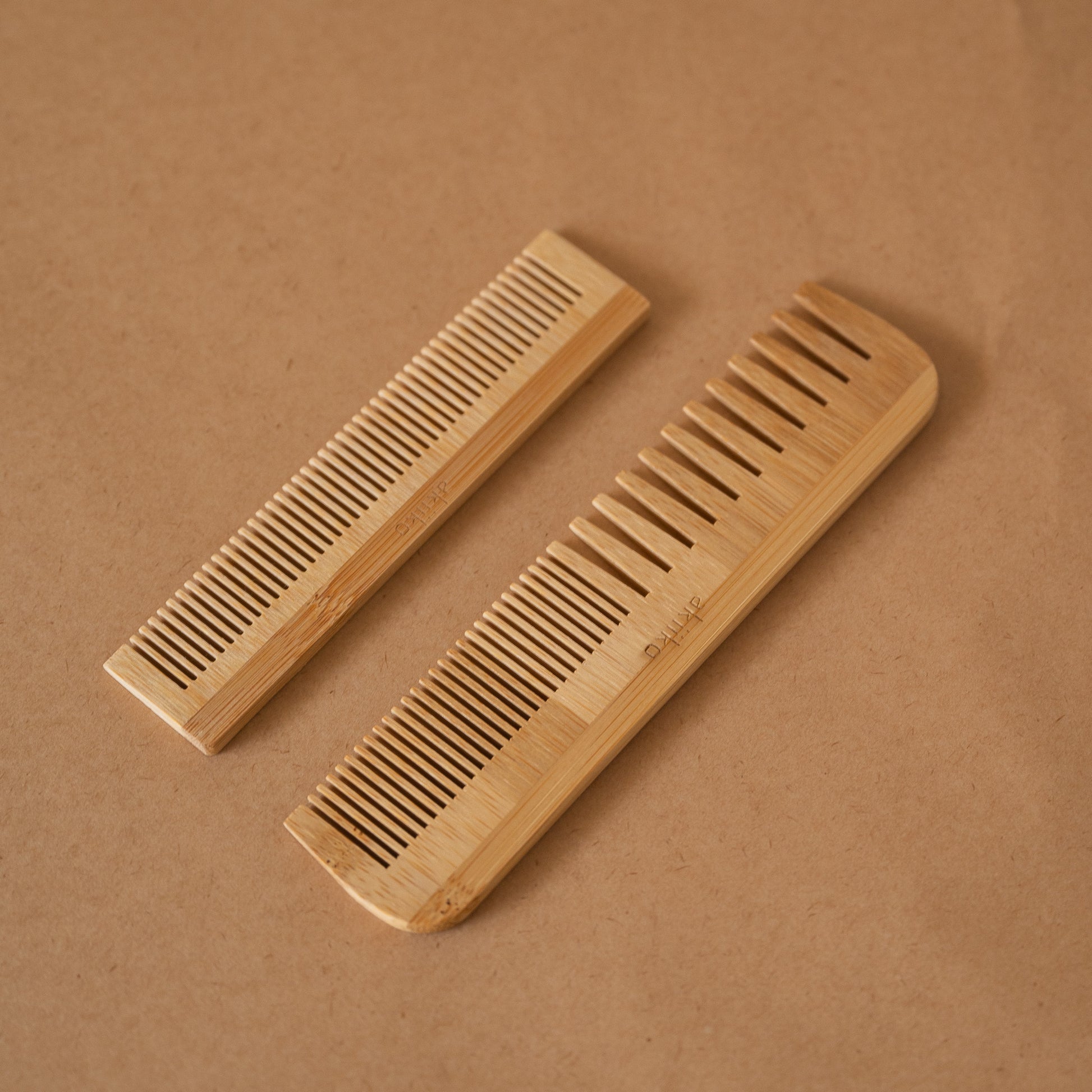 Set of 2 bamboo combs including a pocket comb and a regular comb for gentle detangling and styling.