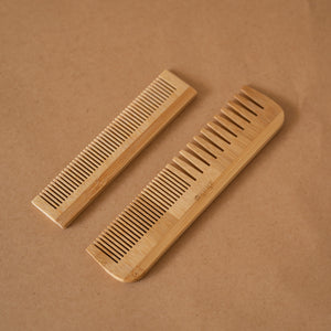 Set of 2 bamboo combs including a pocket comb and a regular comb for gentle detangling and styling.
