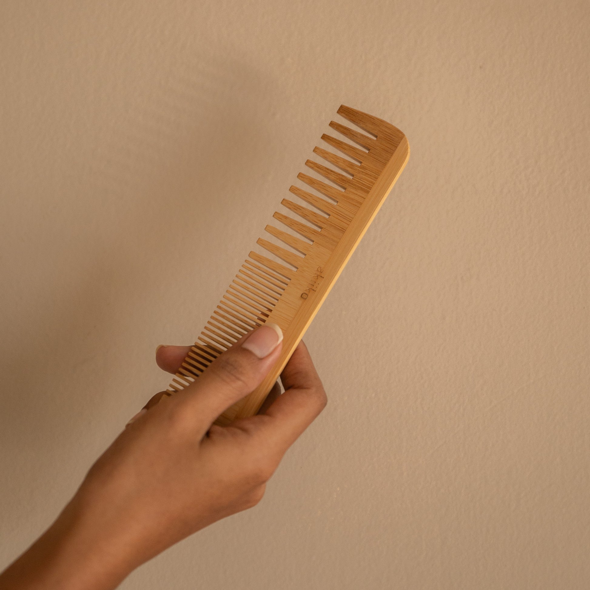 Set of 2 bamboo combs including a pocket comb and a regular comb for gentle detangling and styling.