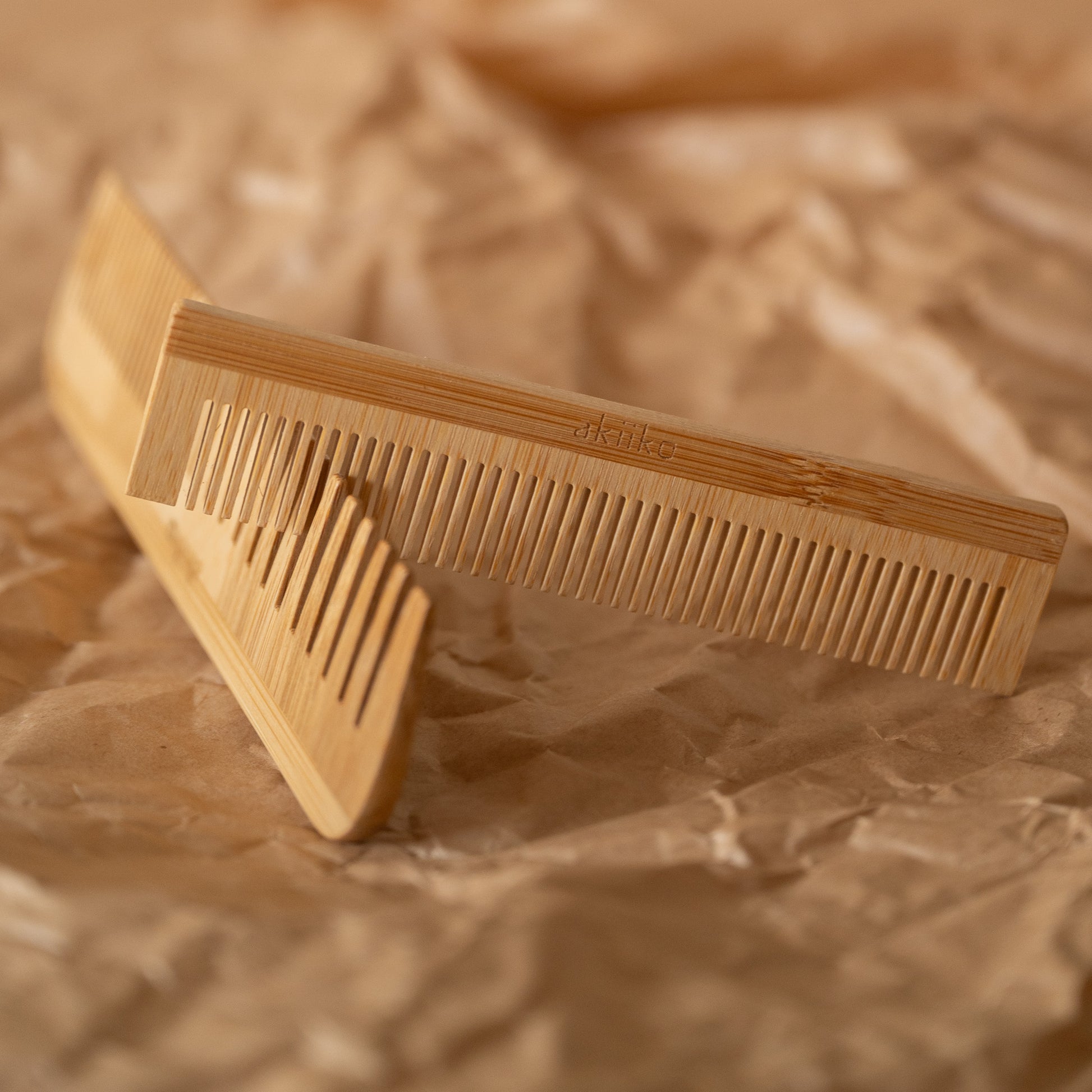 Set of 2 bamboo combs including a pocket comb and a regular comb for gentle detangling and styling.