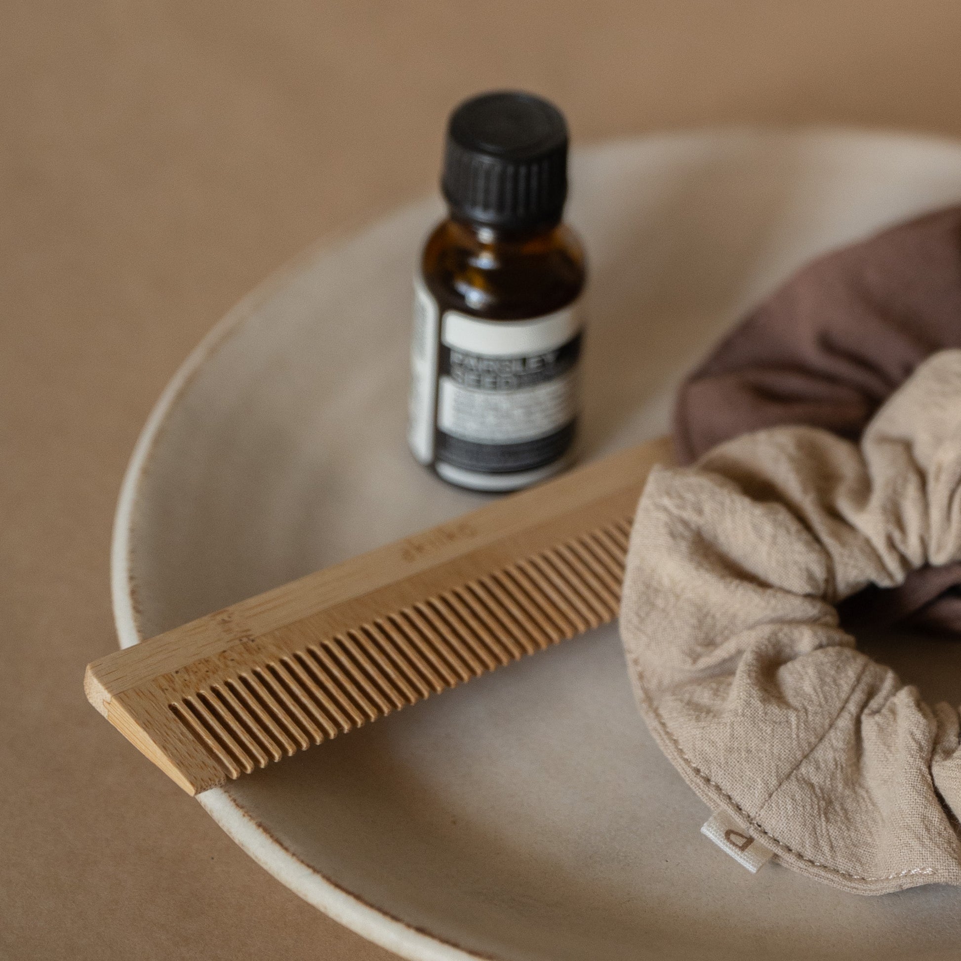 Set of 2 bamboo combs including a pocket comb and a regular comb for gentle detangling and styling.