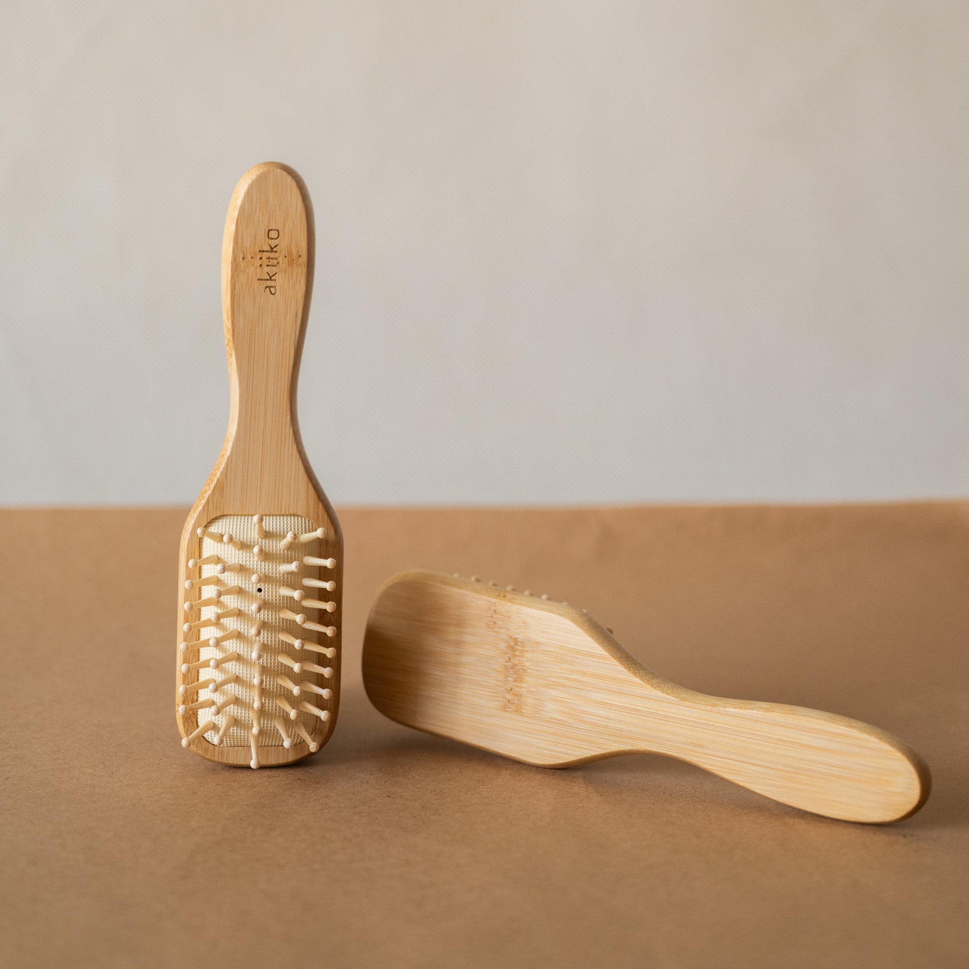 Bamboo Hair Brush with smooth rounded bristles and ergonomic handle for gentle detangling and styling.