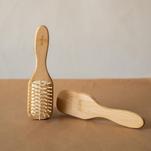 Bamboo Hair Brush with smooth rounded bristles and ergonomic handle for gentle detangling and styling.
