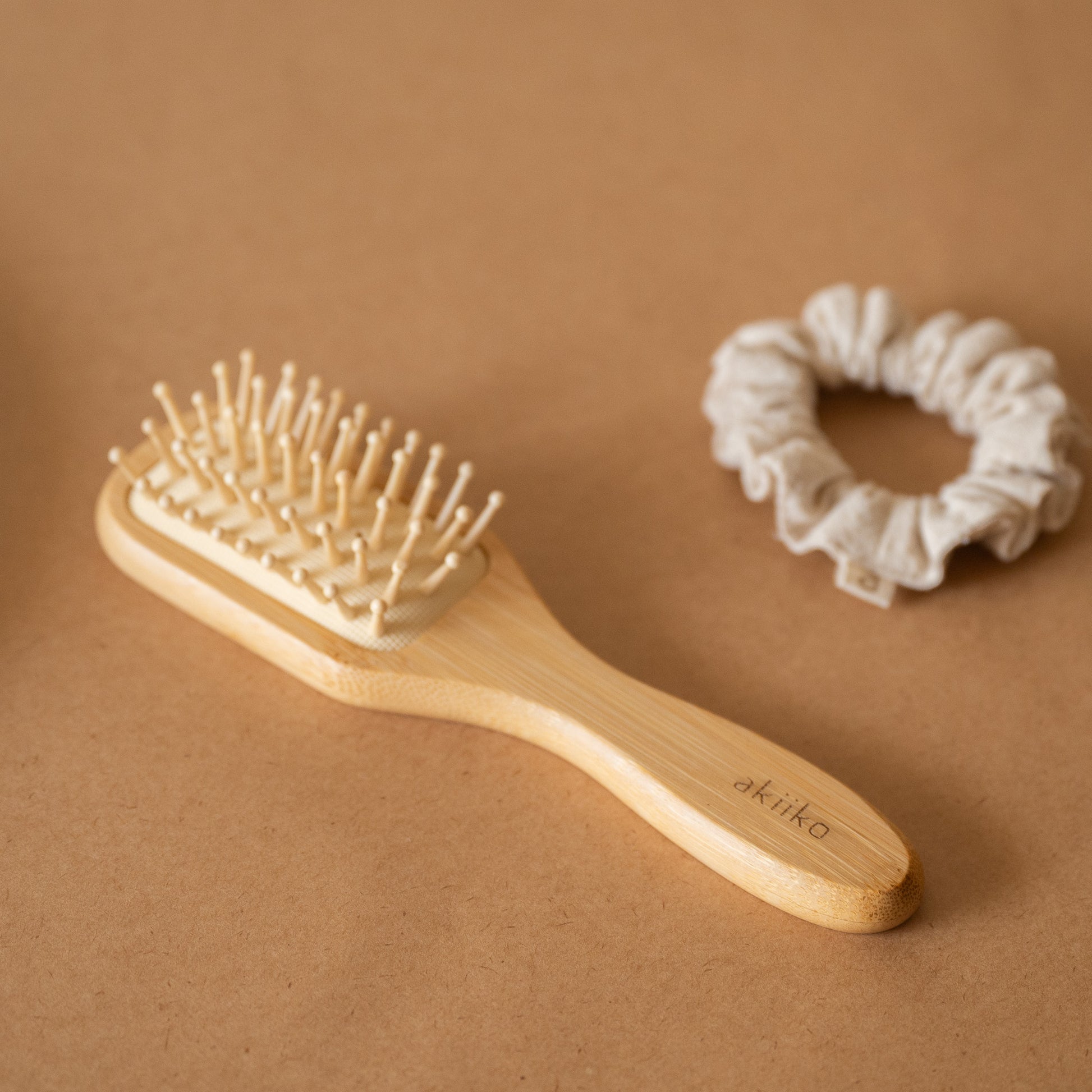 Bamboo Hair Brush with smooth rounded bristles and ergonomic handle for gentle detangling and styling.
