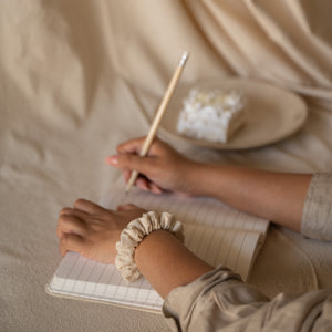 Pack of 6 Chantilly scrunchies made from soft crinkled cotton, packaged in a breathable mesh pouch.