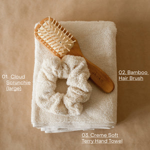 Cloud PM Routine set featuring a soft terry hand towel, plush scrunchie, and eco-conscious bamboo hair brush for nighttime self-care.