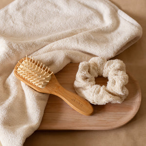 Cloud PM Routine set featuring a soft terry hand towel, plush scrunchie, and eco-conscious bamboo hair brush for nighttime self-care.