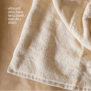 Cloud PM Routine set featuring a soft terry hand towel, plush scrunchie, and eco-conscious bamboo hair brush for nighttime self-care.