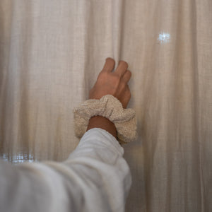 Set of three fluffy terry cotton cloud scrunchies in neutral tones, soft and lightweight, with pouch.
