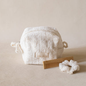 Cloud To-Go Kit (Ivory) featuring a mini cloud cube pouch, soft cloud scrunchie, and bamboo pocket comb for on-the-go organization.