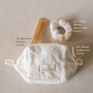 Cloud To-Go Kit (Ivory) featuring a mini cloud cube pouch, soft cloud scrunchie, and bamboo pocket comb for on-the-go organization.