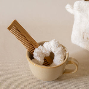 Cloud To-Go Kit (Ivory) featuring a mini cloud cube pouch, soft cloud scrunchie, and bamboo pocket comb for on-the-go organization.