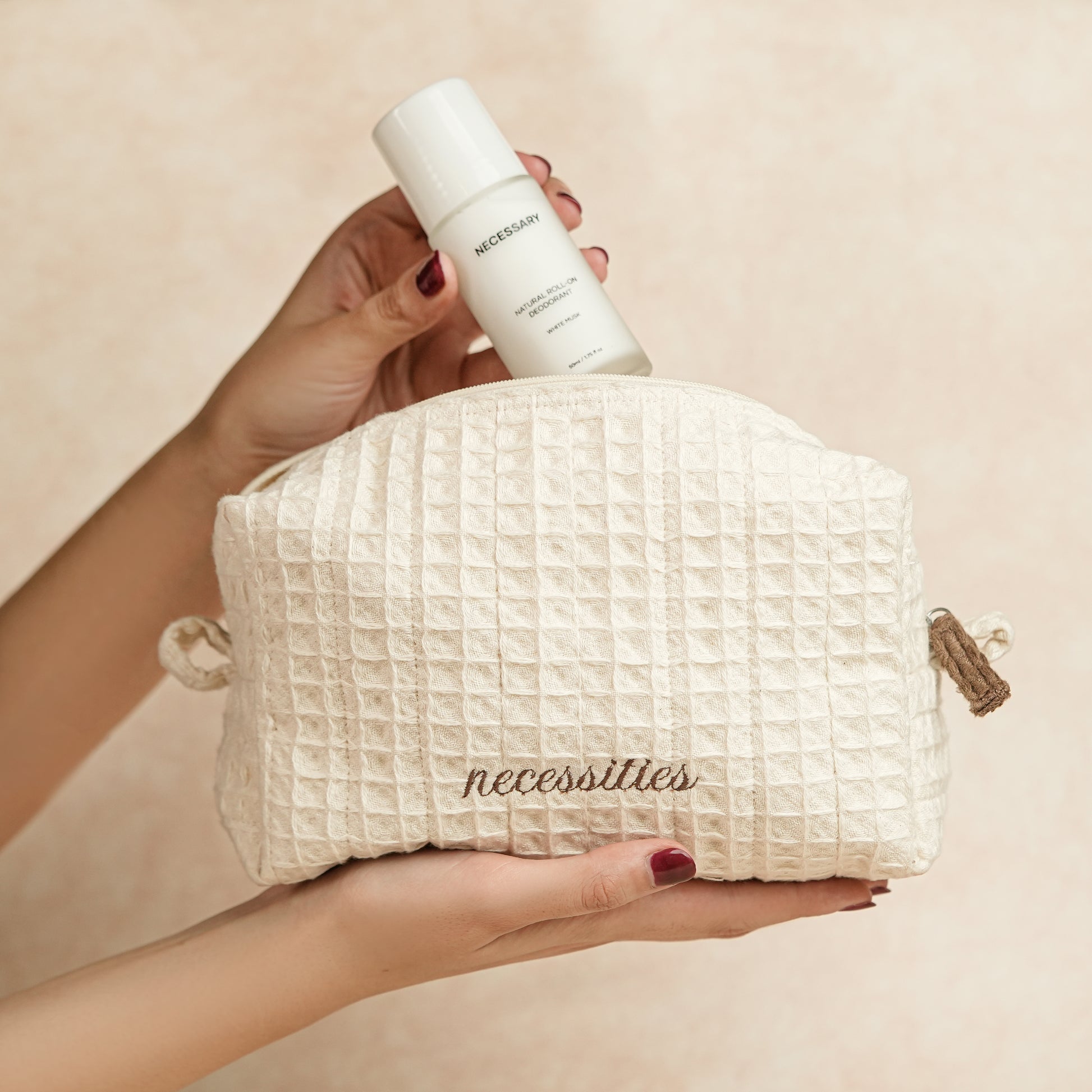 Daily Deo Kit featuring Necessary White Musk aluminum-free deodorant and a waffle-woven cotton pouch with espresso embroidery and zipper accents.
