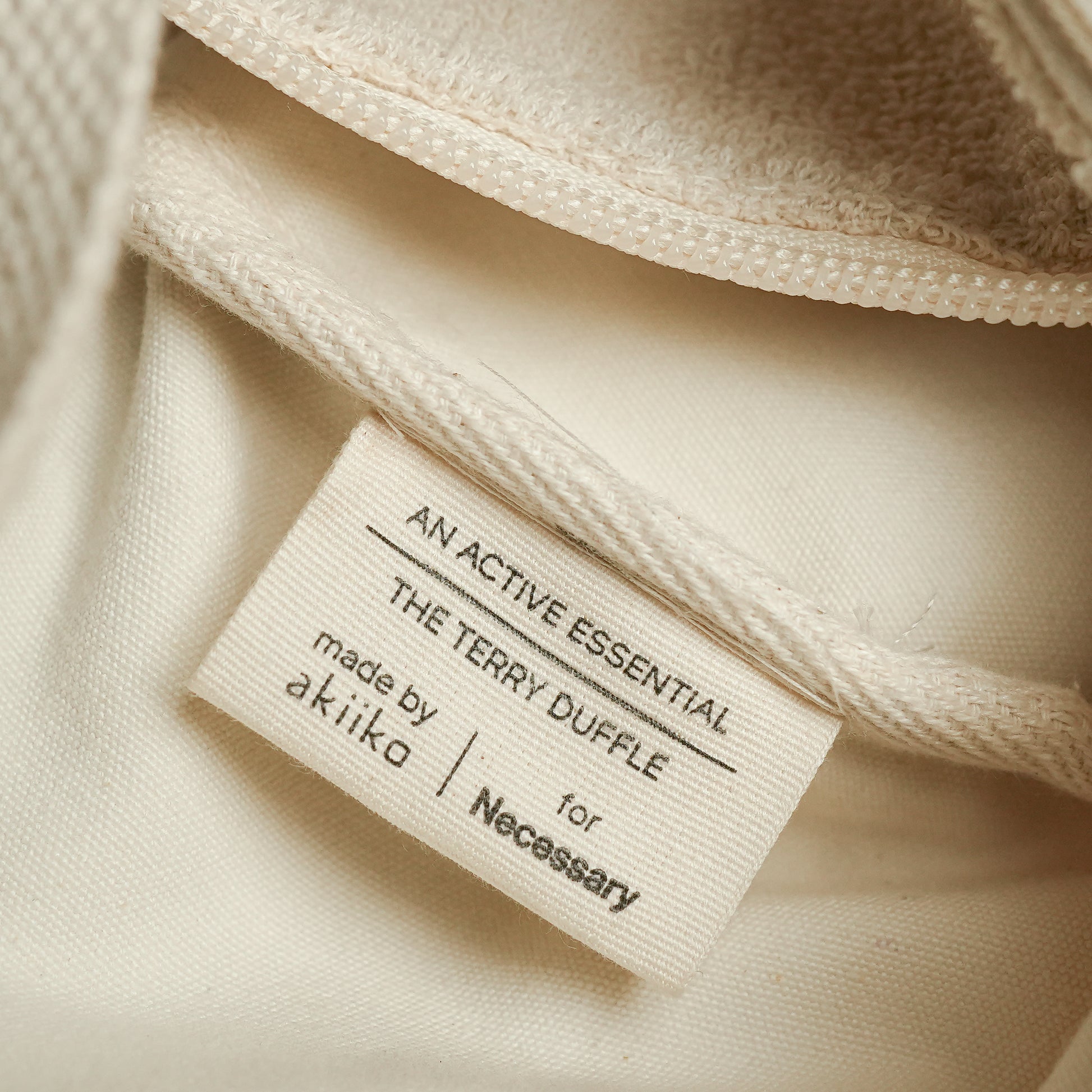 Fresh Companion Set featuring a soft terry cotton duffle with espresso embroidery and charm, matching espresso waffle face towel, and Necessary Amber Wood aluminum-free deodorant.