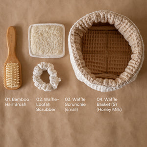 Honey Milk Waffle Care Kit featuring a small waffle storage basket, waffle scrubber, bamboo hair brush, and waffle scrunchie for a soothing daily ritual.