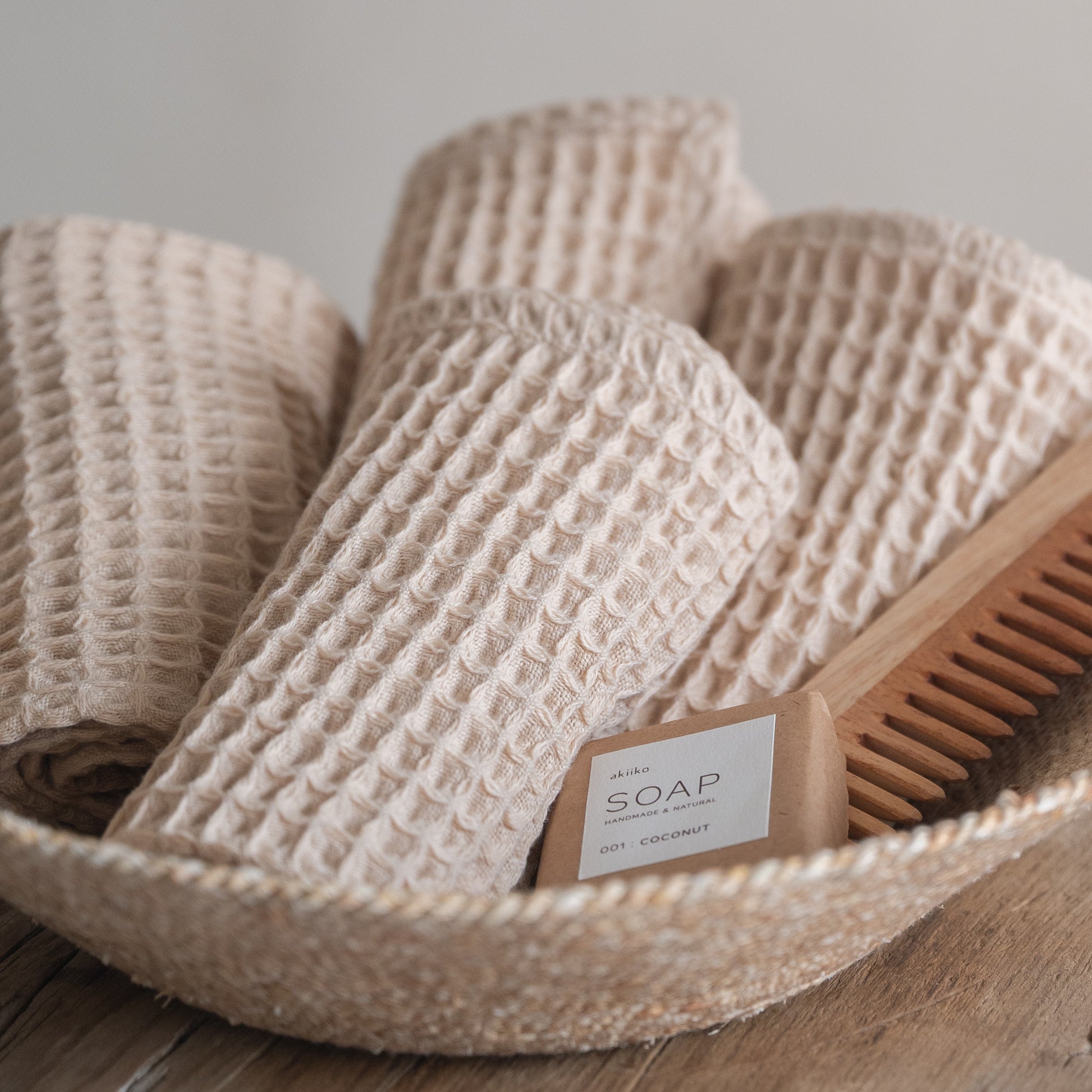 Set of four pique waffle cotton face towels, 30x30 cm, soft, plush, and absorbent with textured weave.