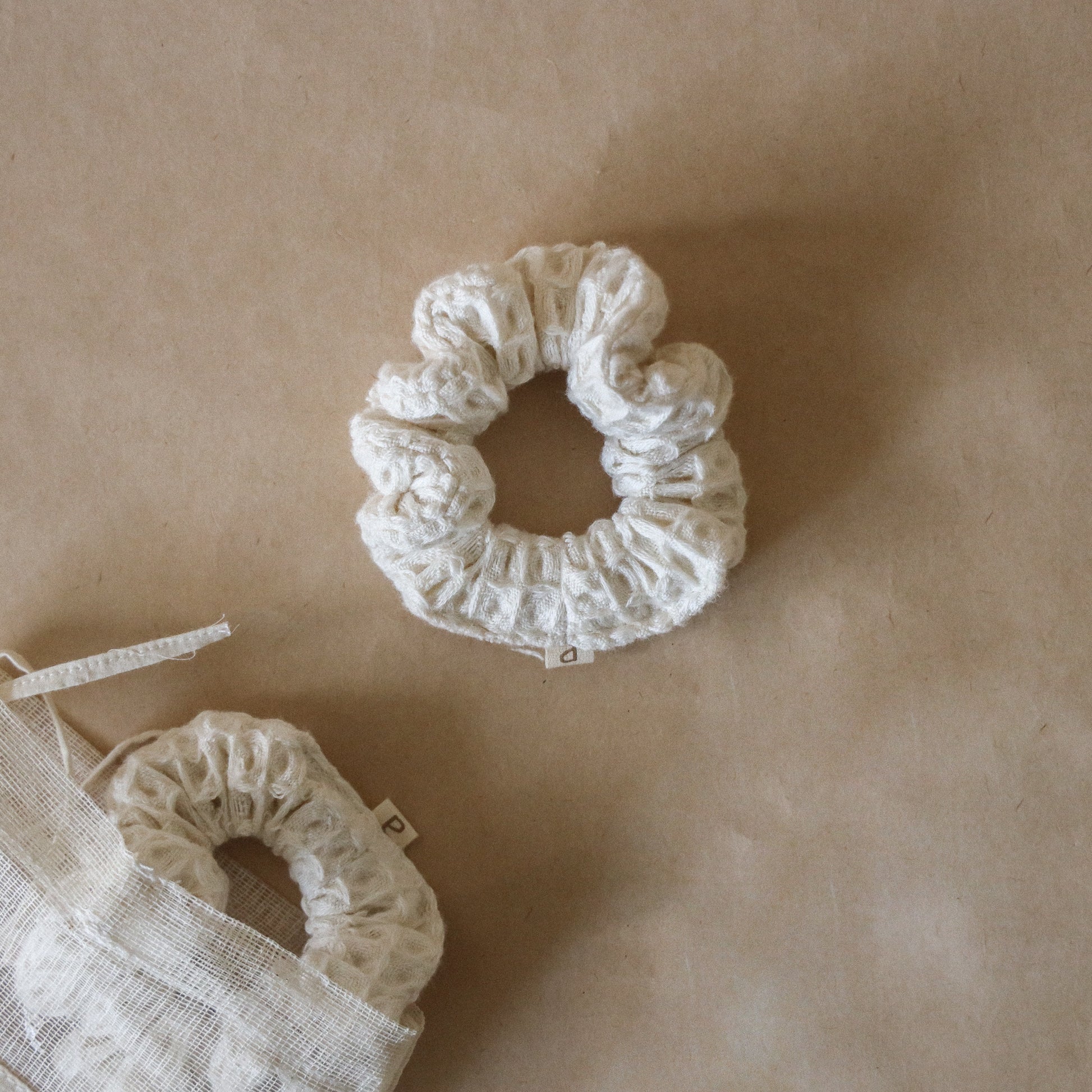 Pack of five wheat-colored pique waffle skinny scrunchies, made from soft stretchy cotton, perfect for hair or wrist accessory.