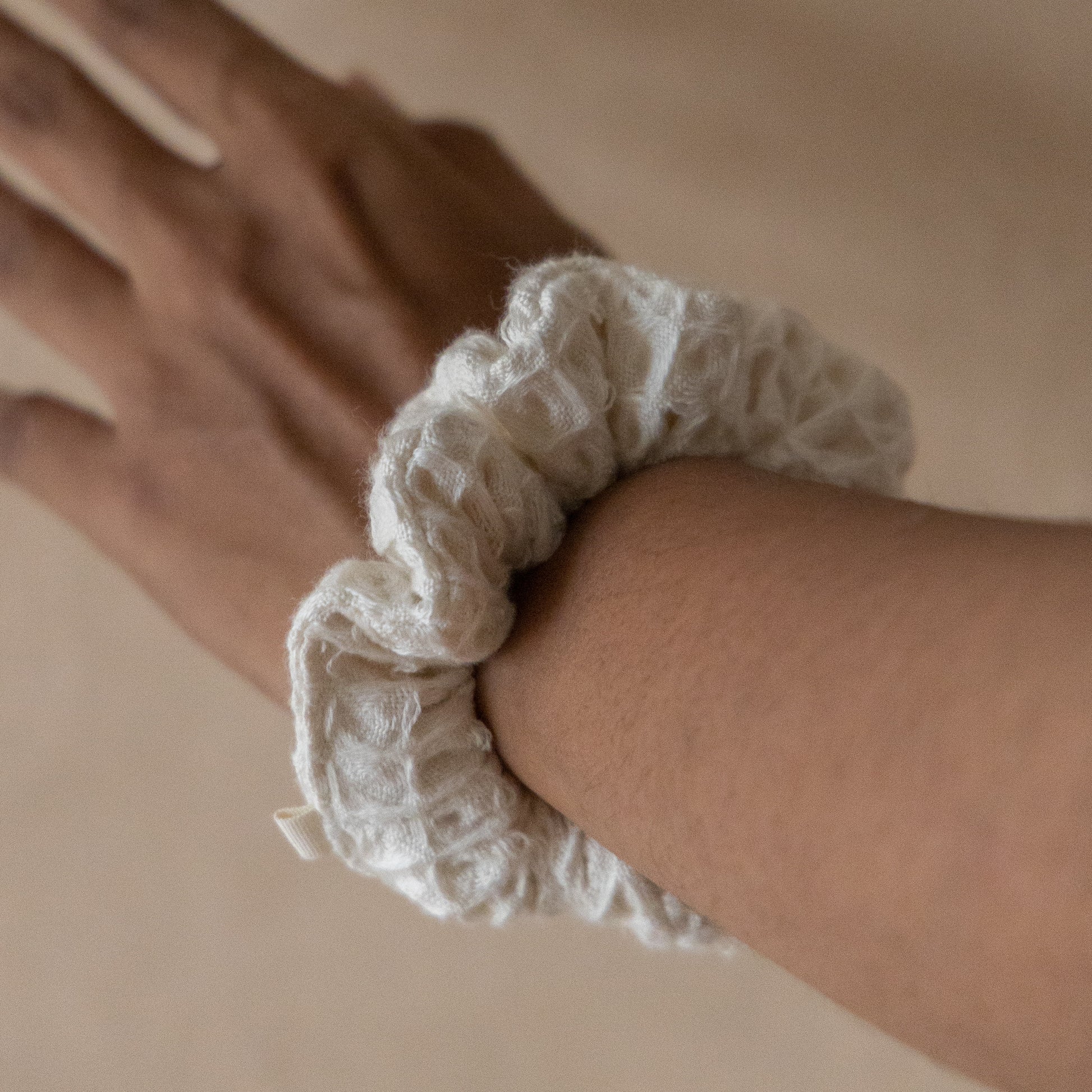 Pack of five wheat-colored pique waffle skinny scrunchies, made from soft stretchy cotton, perfect for hair or wrist accessory.