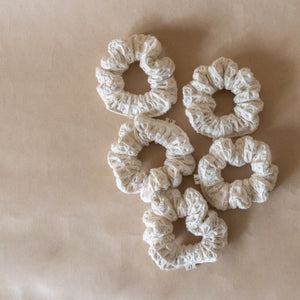 Pack of five wheat-colored pique waffle skinny scrunchies, made from soft stretchy cotton, perfect for hair or wrist accessory.