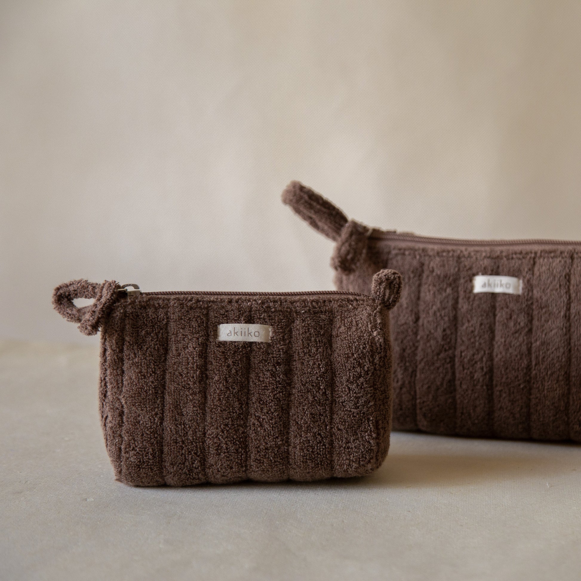 Cloud Triangle Pouches set in three sizes standing on a counter