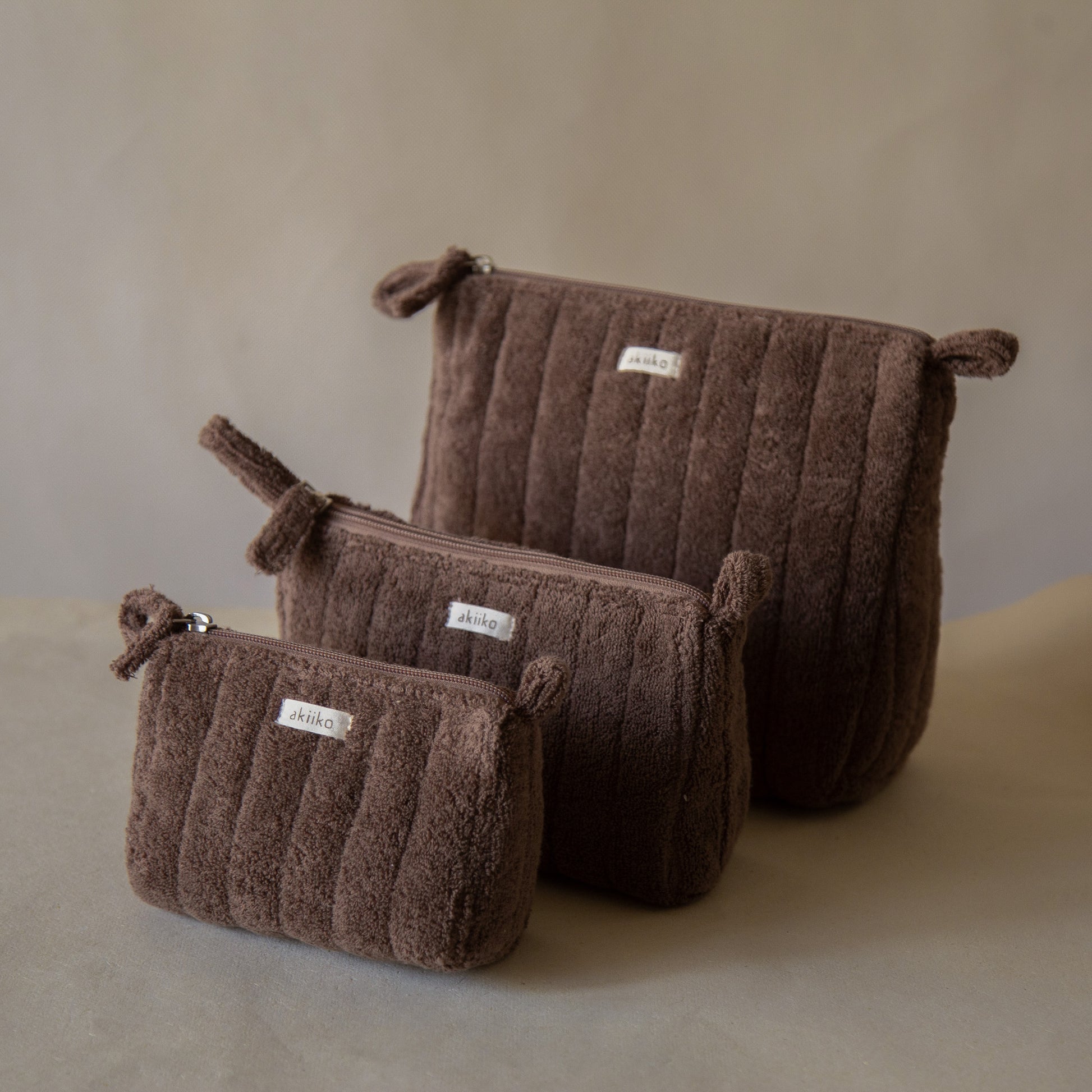 Cloud Triangle Pouches set in three sizes standing on a counter
