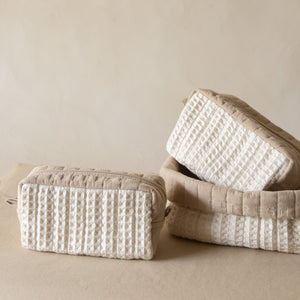 Refresh Waffle Pouch Set featuring a large waffle-crinkle foldover basket embroidered with “REFRESH” and matching small and medium waffle pouches in wheat and natural shades.