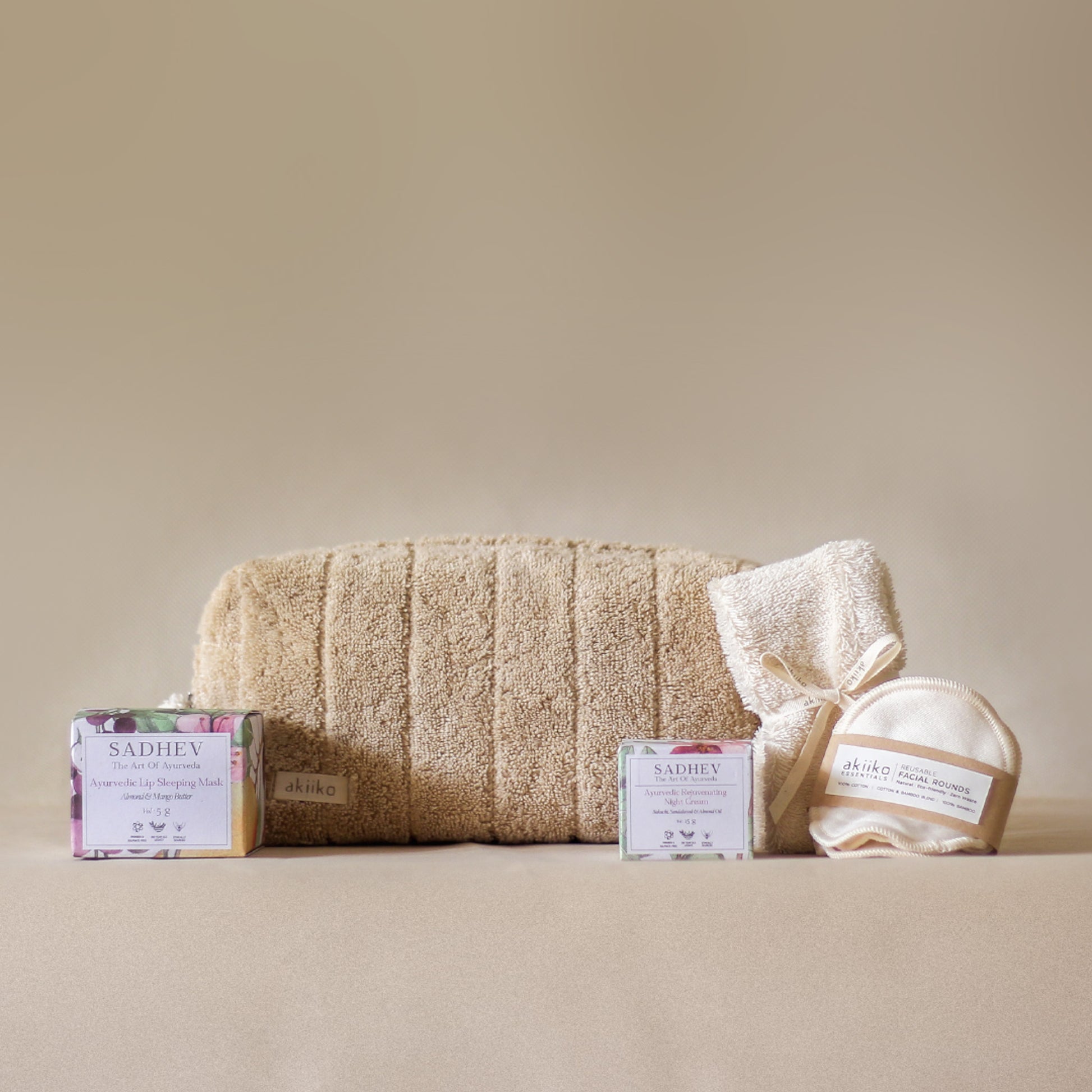 Rest Deeply PM Skincare Routine set featuring night cream, lip sleeping mask, wheat terry dopp pouch, soft hair band, and reusable facial rounds.