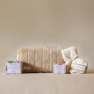 Rest Deeply PM Skincare Routine set featuring night cream, lip sleeping mask, wheat terry dopp pouch, soft hair band, and reusable facial rounds.