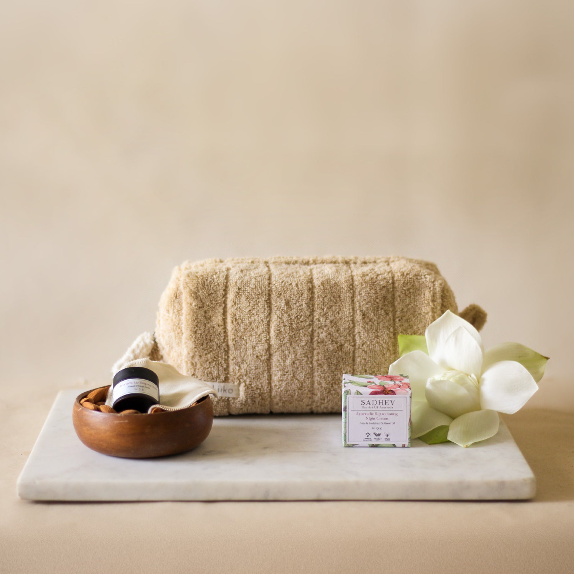 Rest Deeply PM Skincare Routine set featuring night cream, lip sleeping mask, wheat terry dopp pouch, soft hair band, and reusable facial rounds.