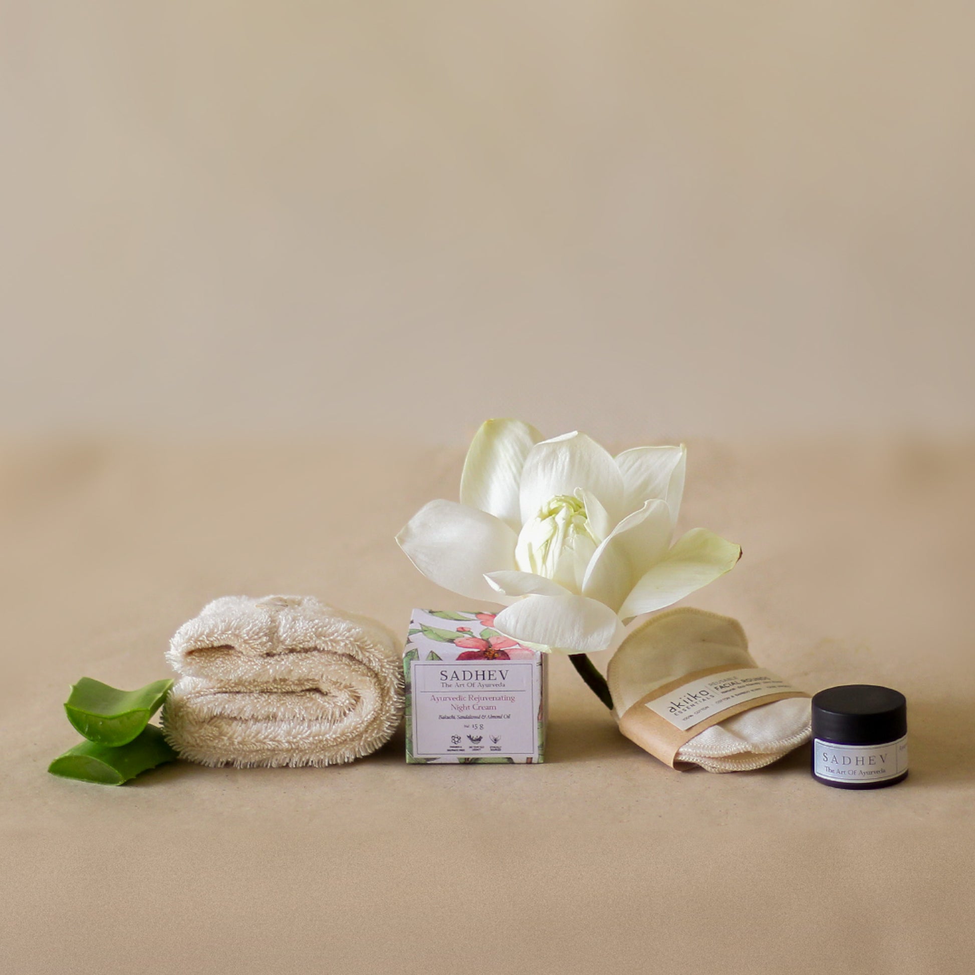 Rest Deeply PM Skincare Routine set featuring night cream, lip sleeping mask, wheat terry dopp pouch, soft hair band, and reusable facial rounds.