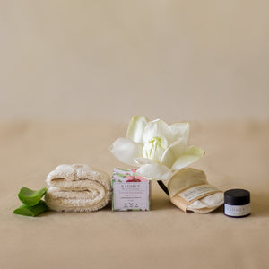 Rest Deeply PM Skincare Routine set featuring night cream, lip sleeping mask, wheat terry dopp pouch, soft hair band, and reusable facial rounds.