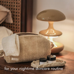 Rest Deeply PM Skincare Routine set featuring night cream, lip sleeping mask, wheat terry dopp pouch, soft hair band, and reusable facial rounds.