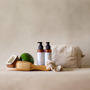 Roots & Rituals Hair Care Set featuring Ayurvedic shampoo and conditioner, bamboo hair brush, crinkle scrunchie, and curl pouch.