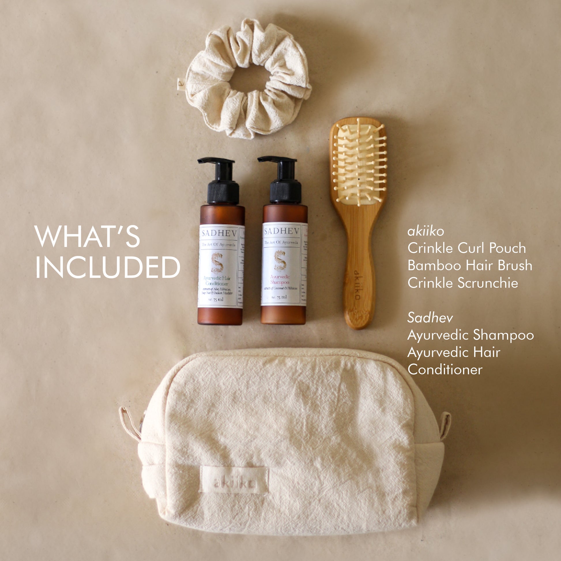 Roots & Rituals Hair Care Set featuring Ayurvedic shampoo and conditioner, bamboo hair brush, crinkle scrunchie, and curl pouch.