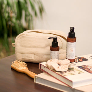 Roots & Rituals Hair Care Set featuring Ayurvedic shampoo and conditioner, bamboo hair brush, crinkle scrunchie, and curl pouch.