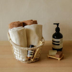 Pack of two soft terry cotton hand towels with zero-twist texture, plush and highly absorbent.