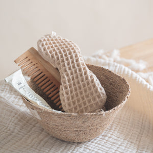 Cotton waffle sleep mask with textured pique fabric, elasticated band, and matching pouch.