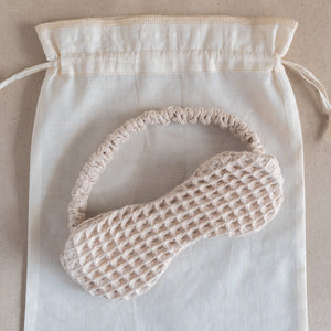 Cotton waffle sleep mask with textured pique fabric, elasticated band, and matching pouch.