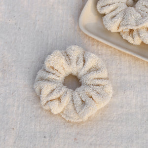 Set of three fluffy terry cotton cloud scrunchies in neutral tones, soft and lightweight, with storage bag.